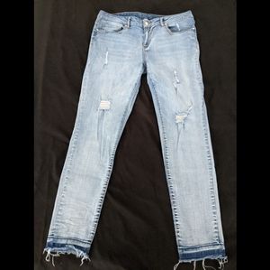 Distressed light blue jeans